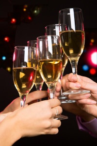 Happy Christmas. Image of people hands with crystal glasses full of champagne