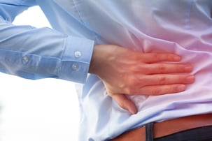 Man in office uniform having back pain issue / back injury